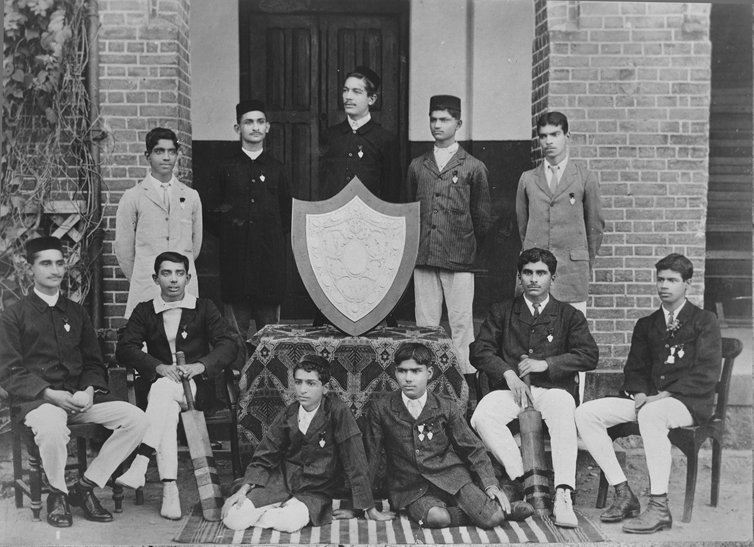 St. Vincent's School cricket team, circa 1910 Merwan (Meher Baba) seated left on the ground