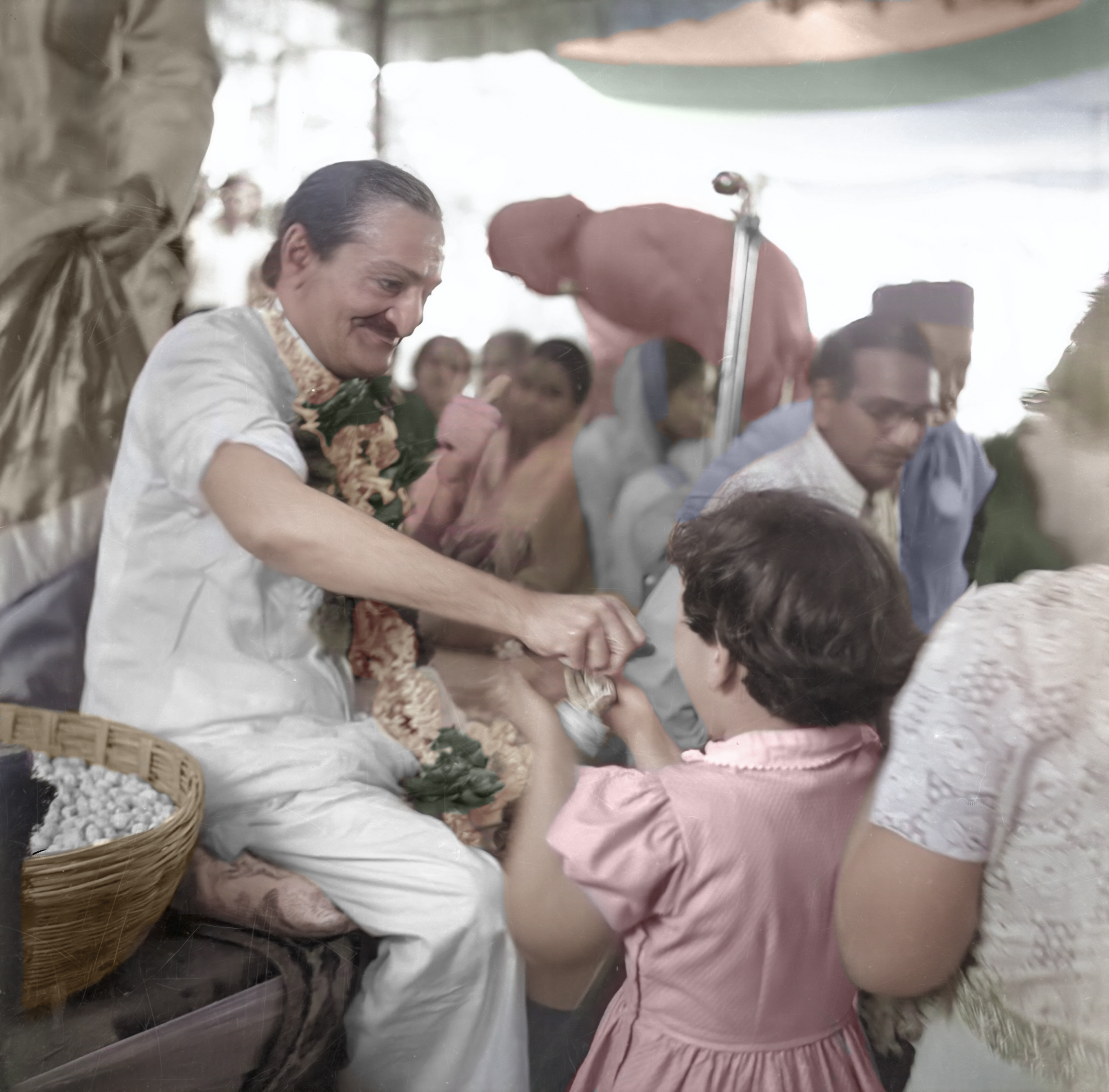 distributing prasad at Wadia Park colorized by Jim Kirkpatrick